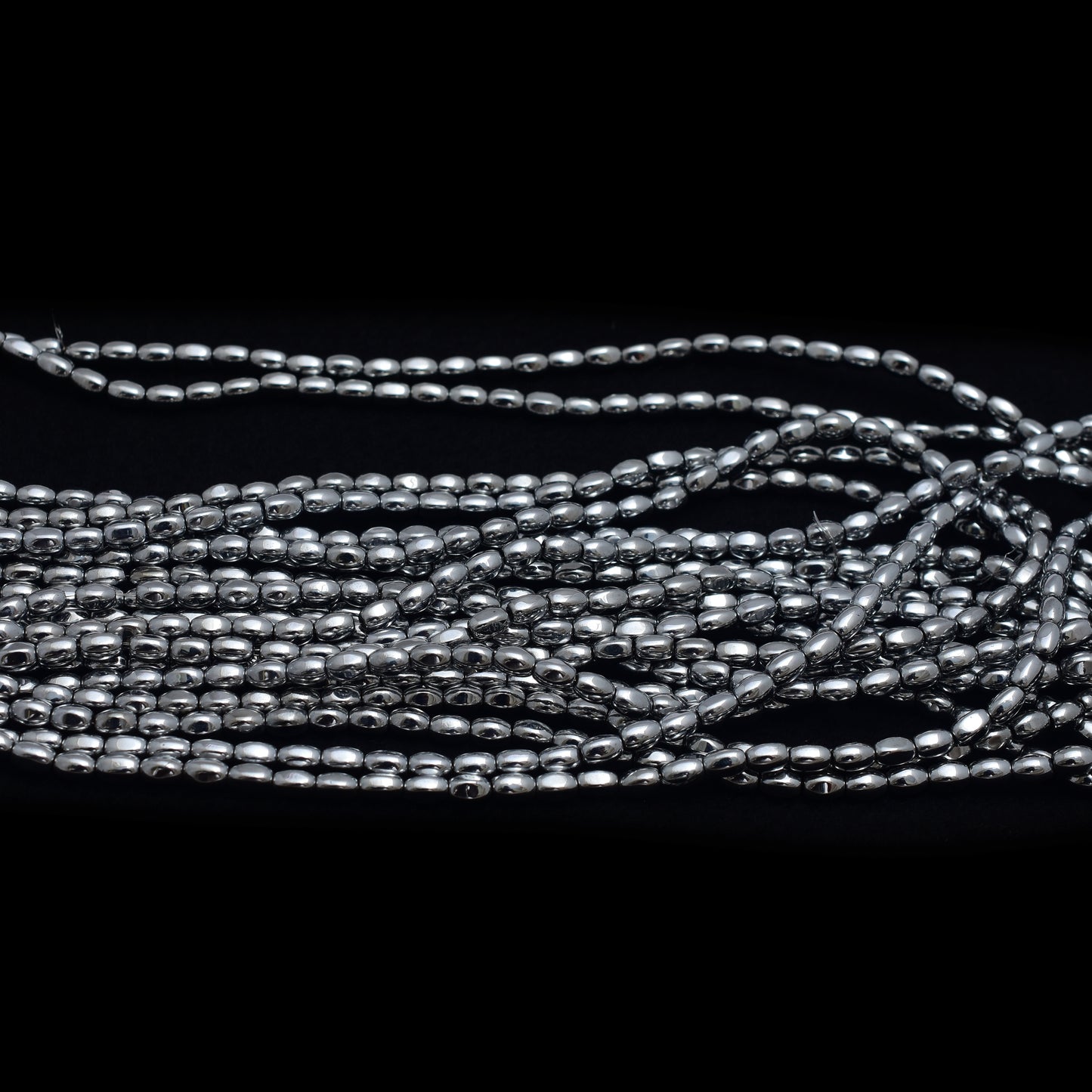 Kamal Gems | Gray Barrel-Shaped Hematite Beads Strand